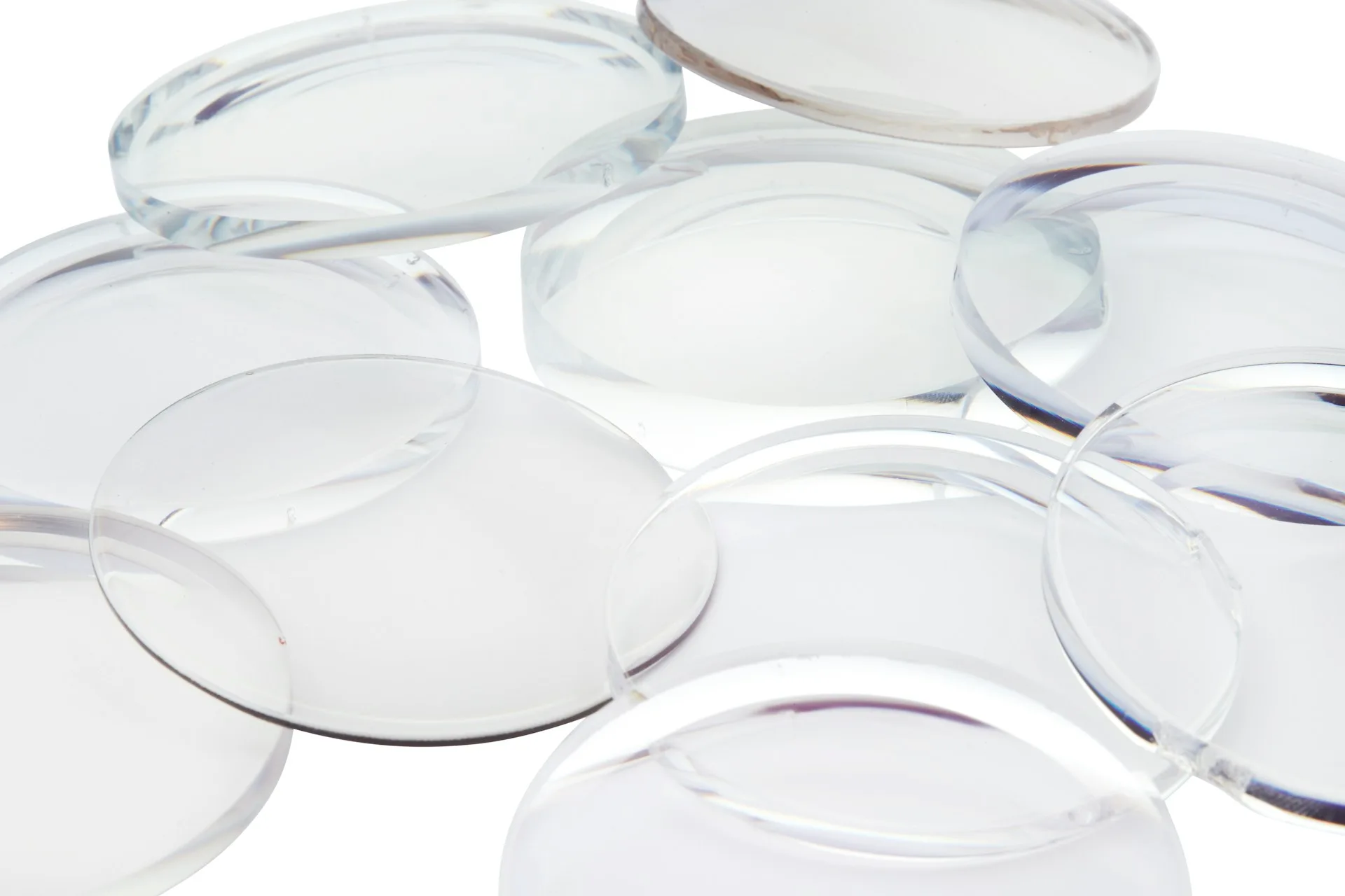 Industry context: Unframed clear optical lenses on a white background.