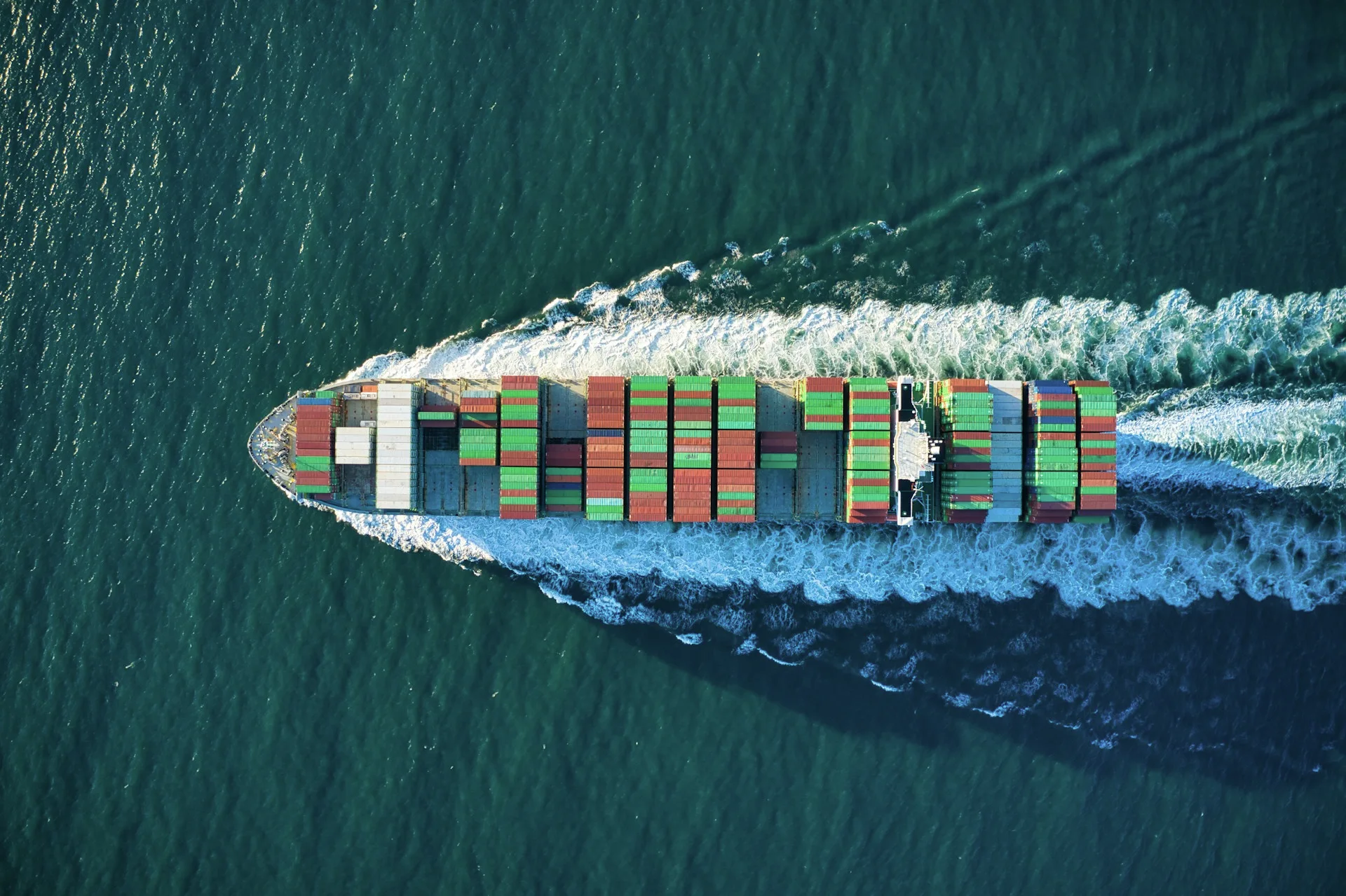 Industry context: Container ship underway at sea.