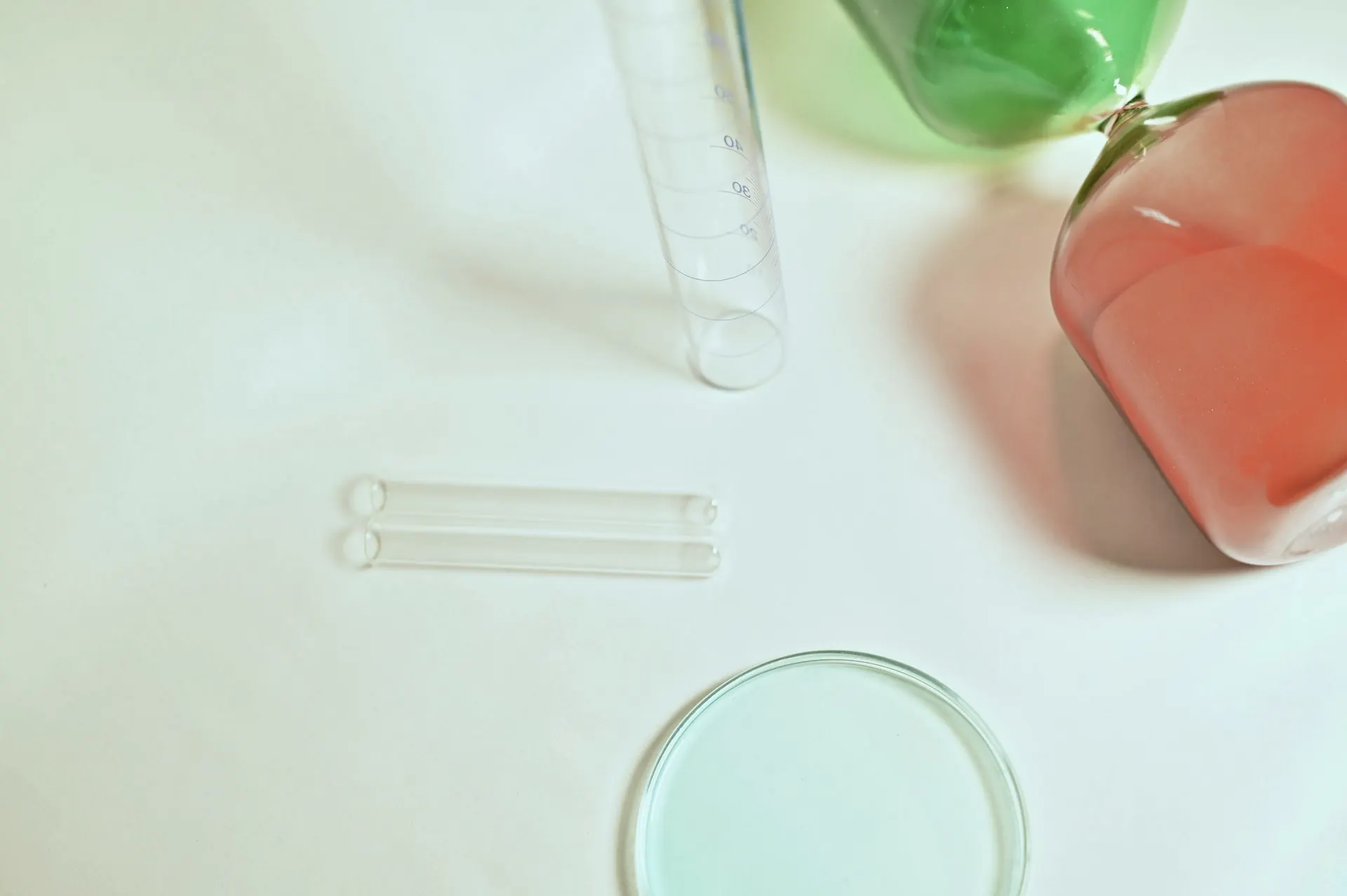 Industry context: Glassware on a pale laboratory work surface.