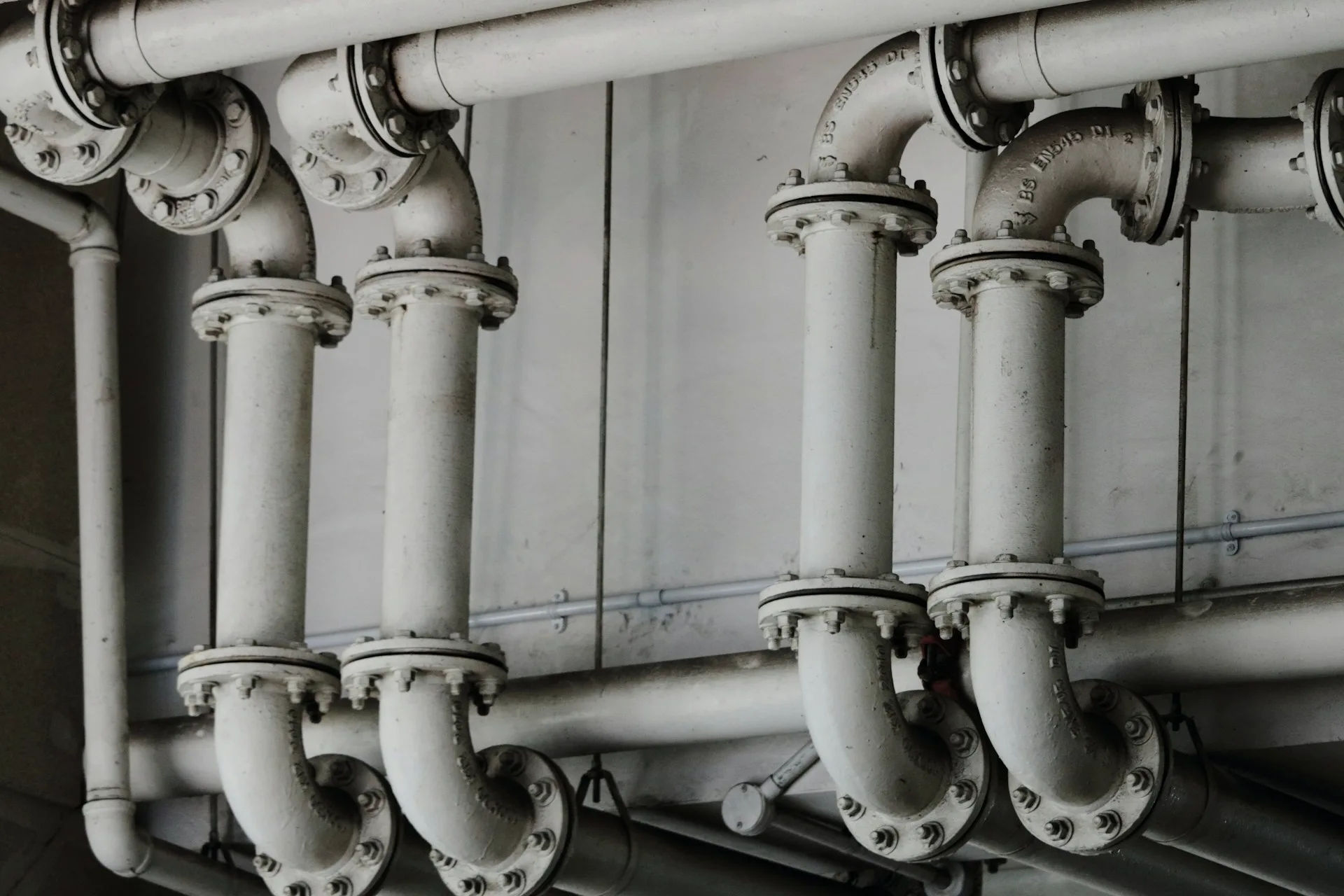 Industry context: Flanged metal pipework.